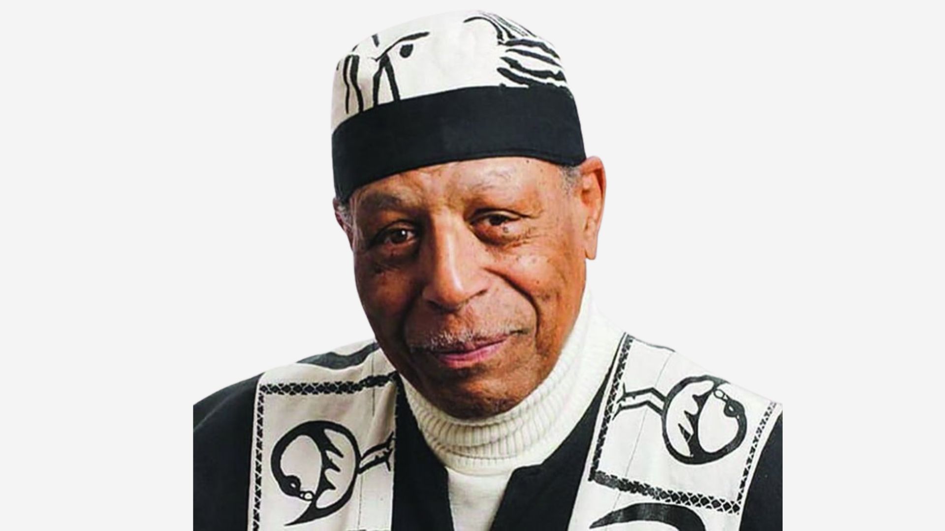A Black man wearing a hat and a white shirt.