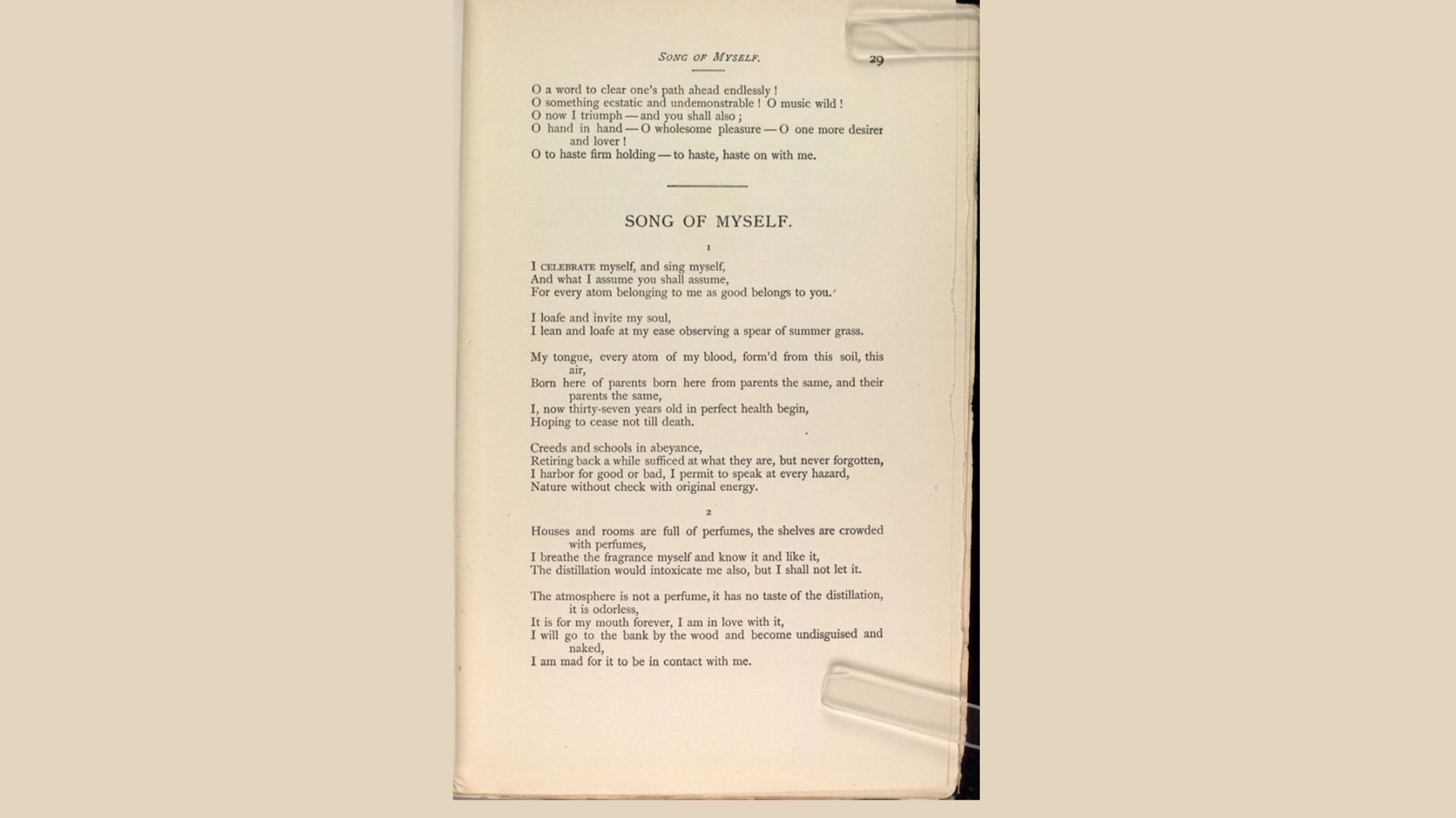 A book open to the front page displaying a poem in elegant typography.