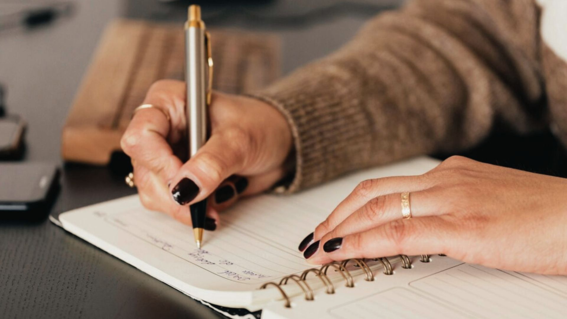 A girl writing in her notebook.