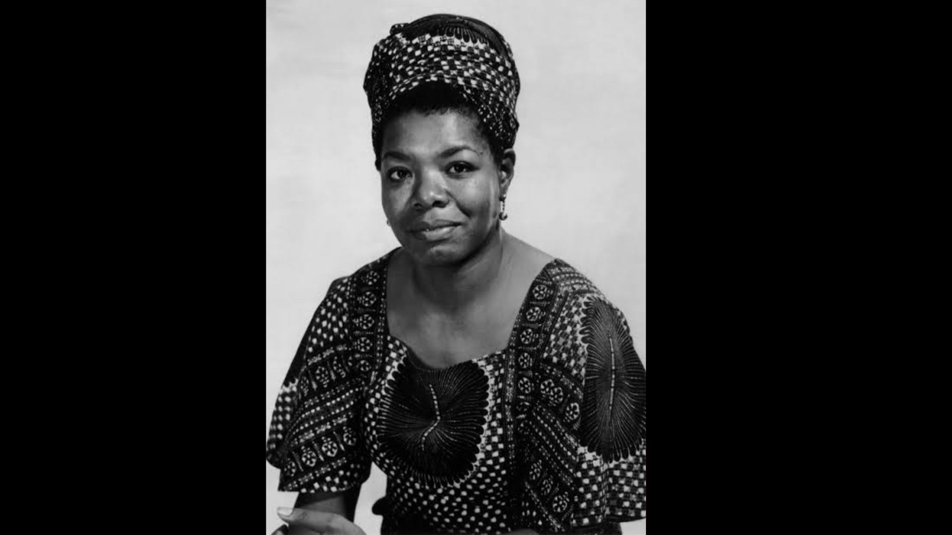 Portrait of Maya Angelou in patterned traditional attire.