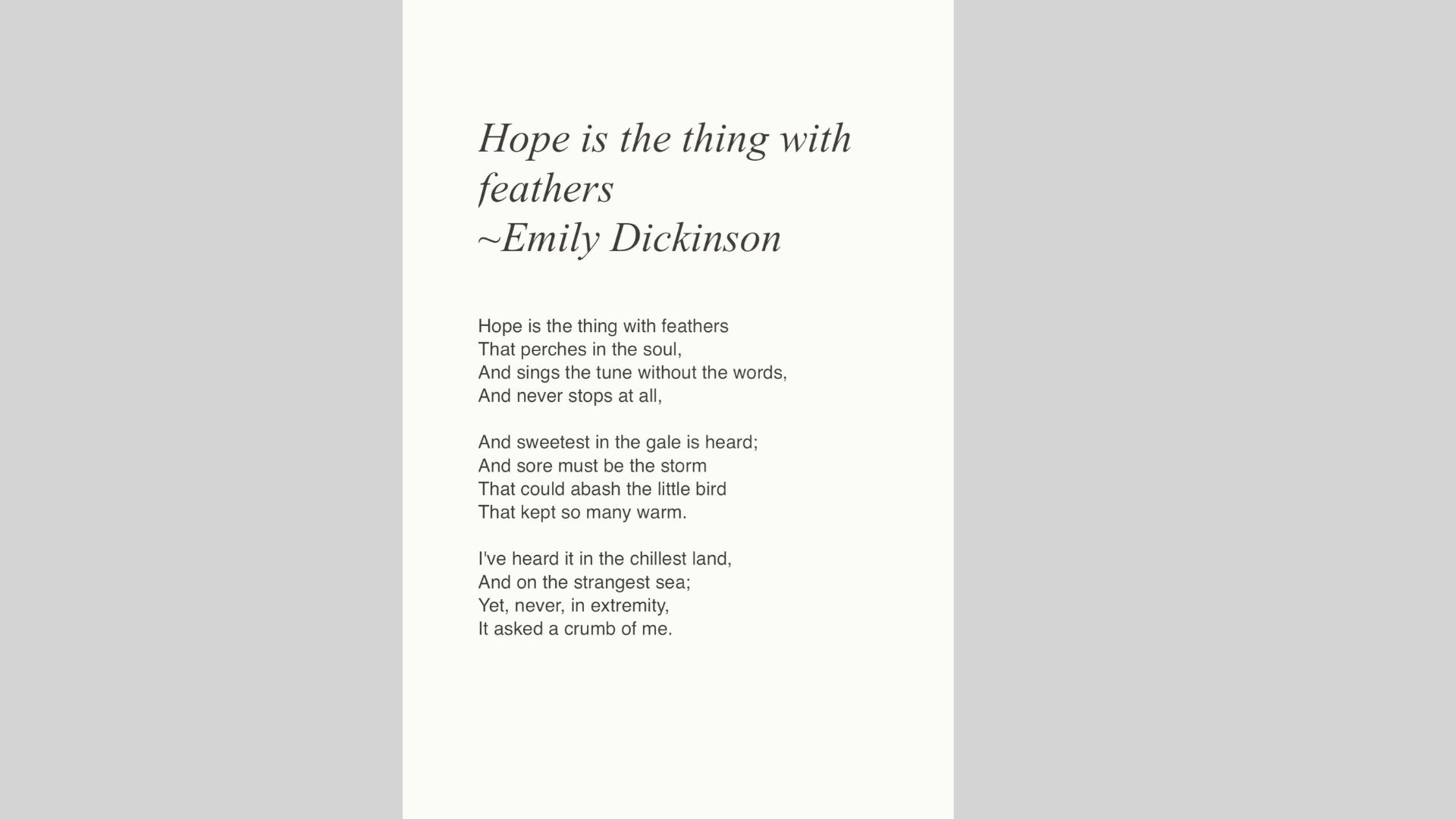 Close-up of a book page showing the title “Hope is the thing with feathers” by Emily Dickinson on aged paper.