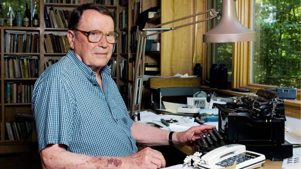 Richard Wilbur seated at a desk with a typewriter in his studyFile Name-richard-wilbur-poet-typewriter-study