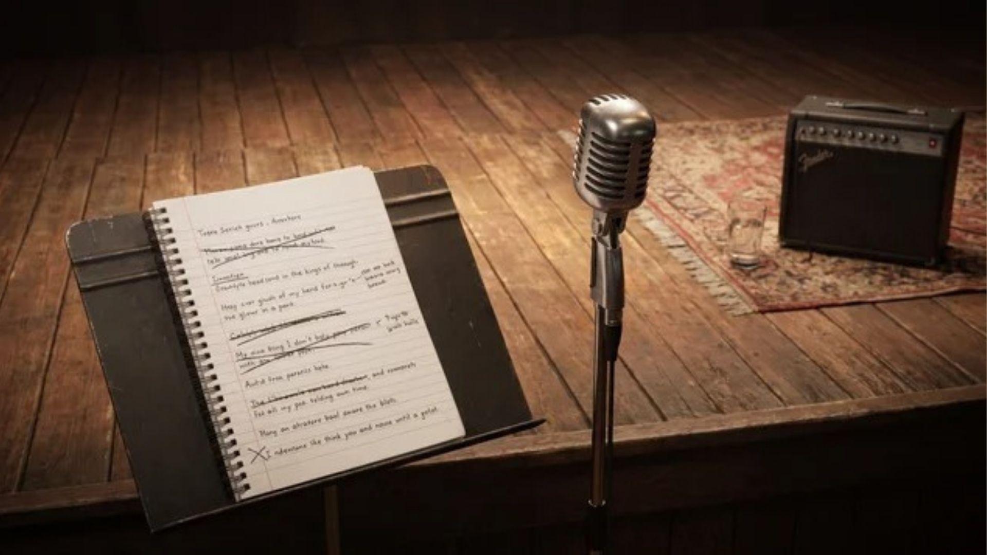 Spoken word poem script and microphone arranged on a small stage