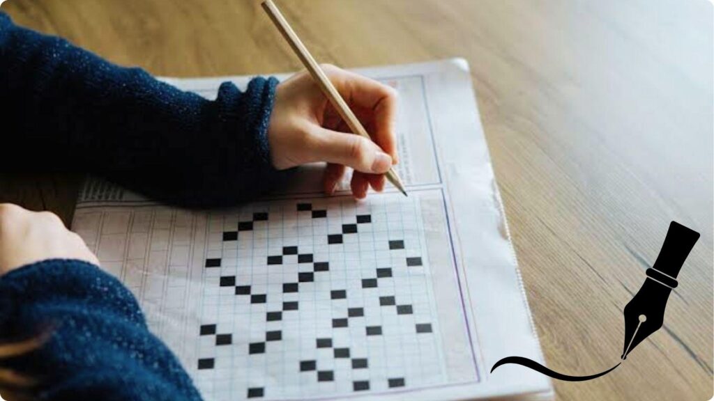 Closeup hand holding pencil solving crossword puzzle on newspaper.