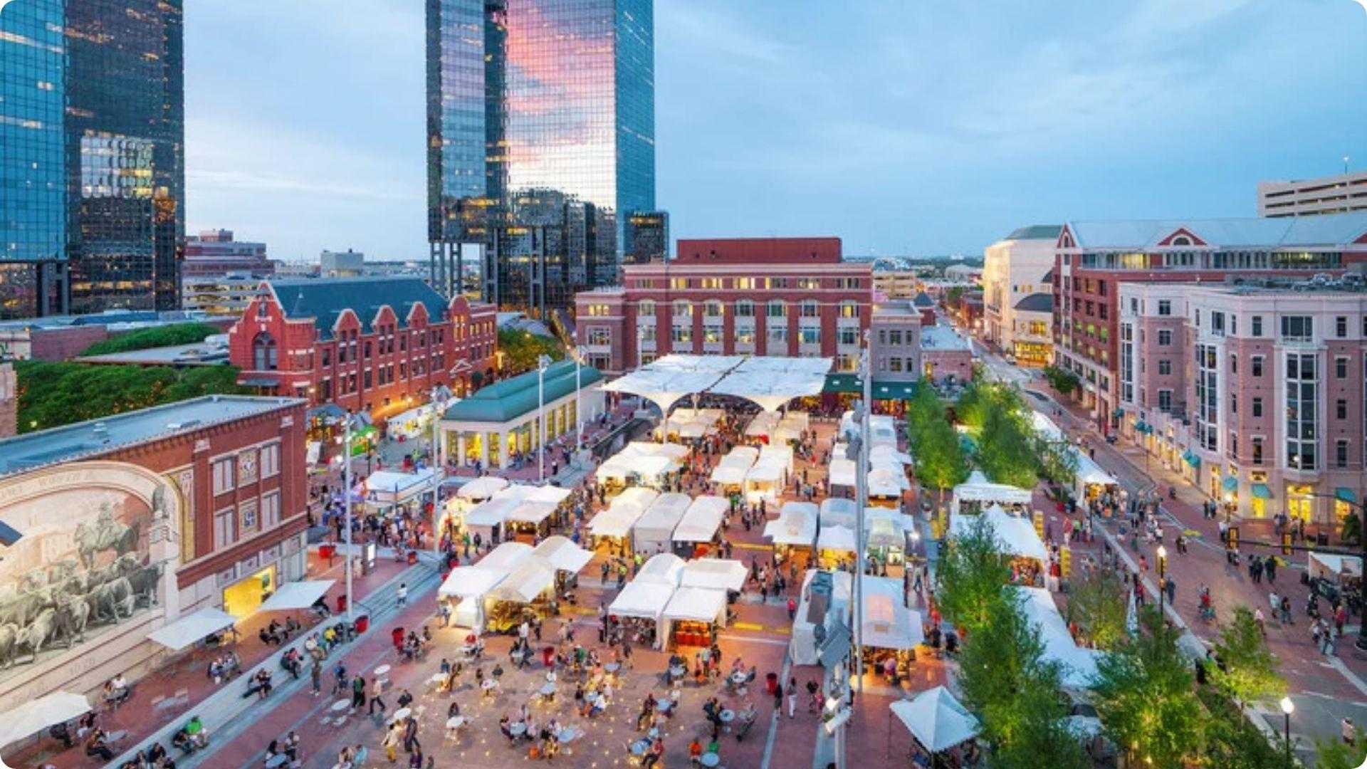 Bustling outdoor festival with white tents in urban plaza.File name-poems-of-city-life