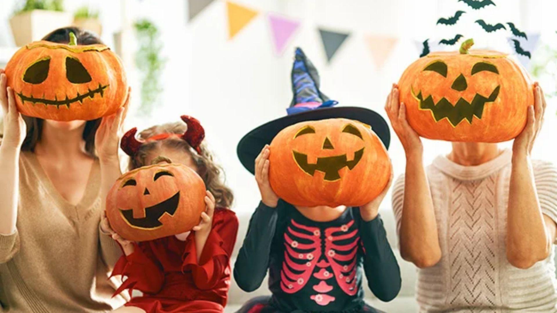 Family holds carved pumpkin masks, wearing Halloween costumes.File name-classic-halloween-poems